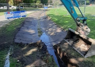 A shallow swale (about 450mm deep) is being excavated that will take the water off of the cycle track